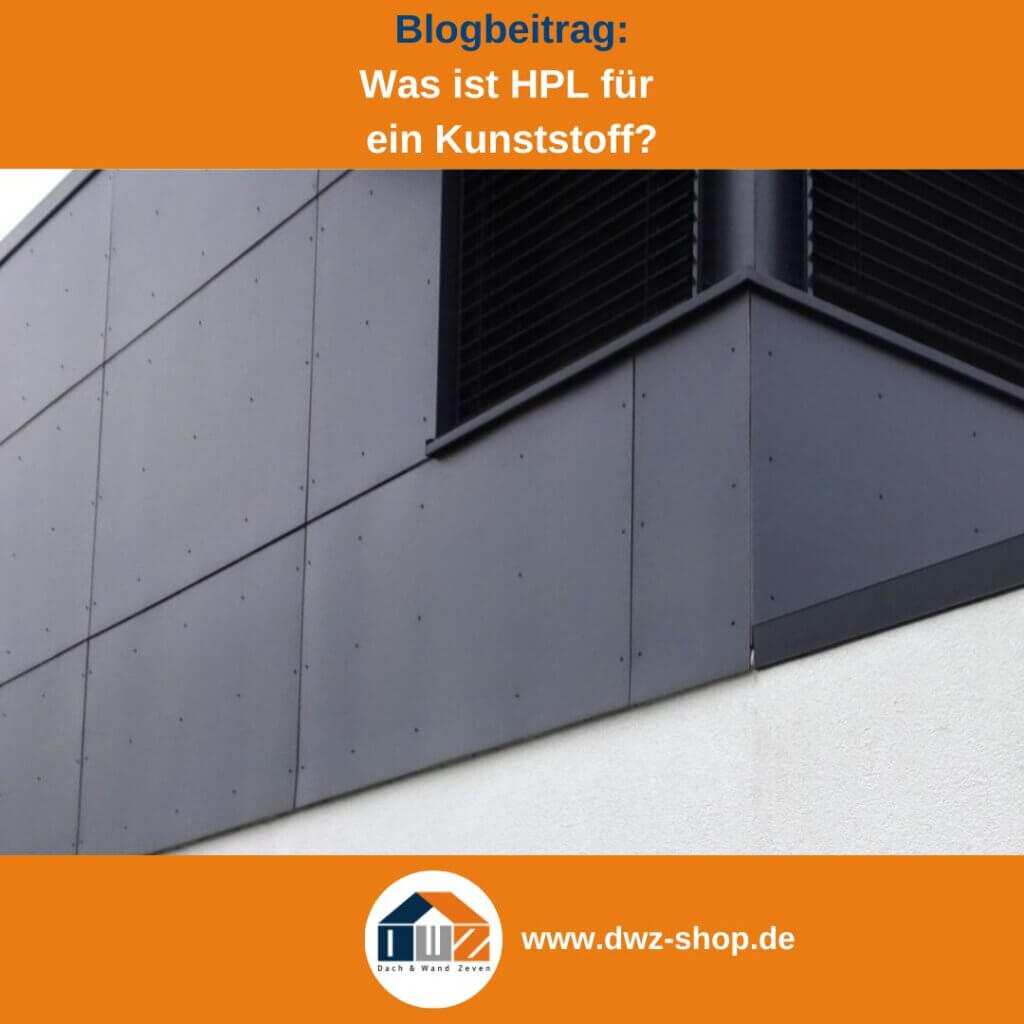 Ein weißes Wohngebäude verkleidet mit anthrazitgrauen HPL Massivplatten.